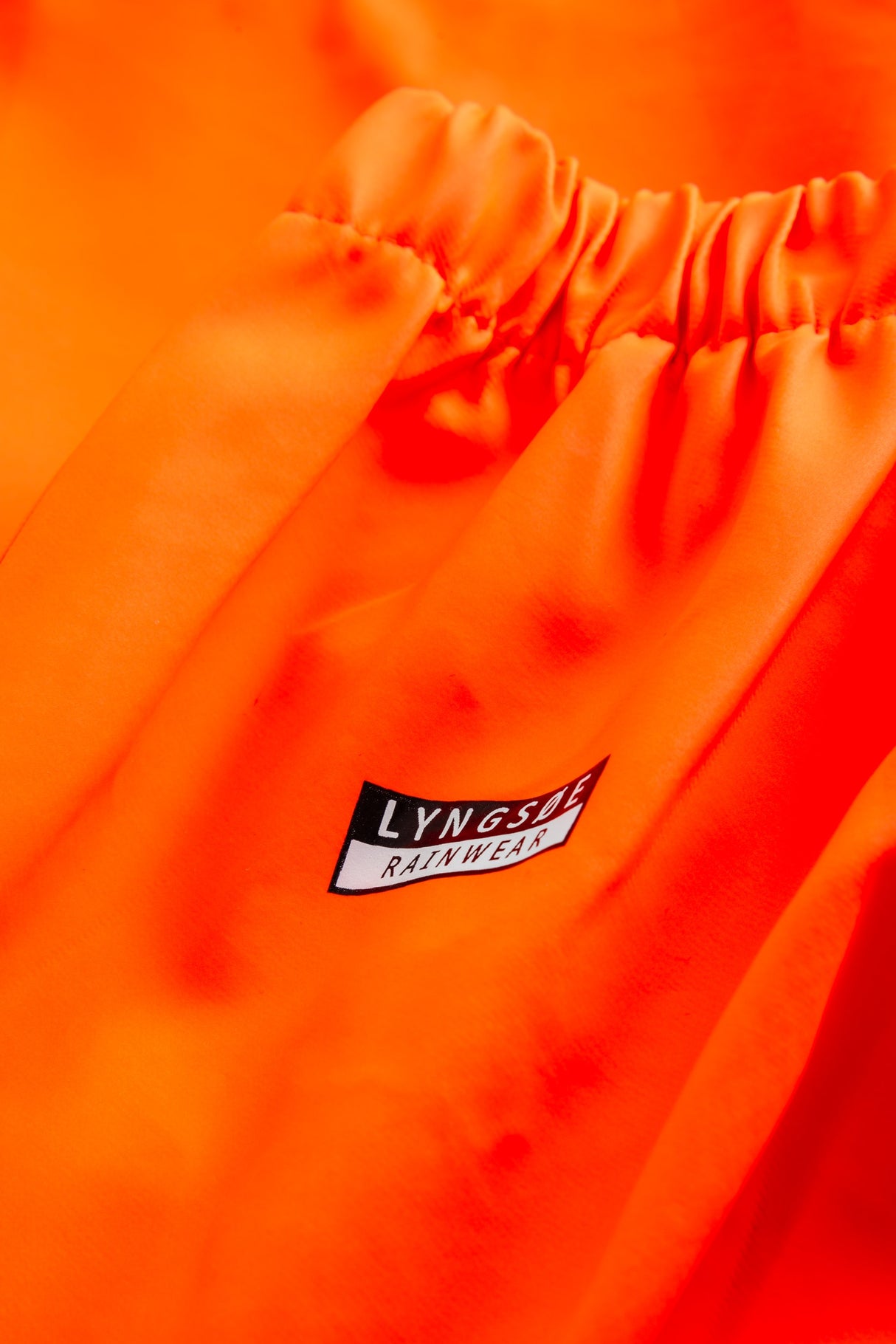 Multinorm Hi-Vis bukser i ekstra kraftig PVC kvalitet - Hi-Vis Orange