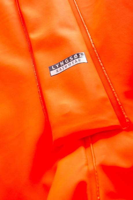 Multinorm Hi-Vis dragt i ekstra kraftig PVC kvalitet - Hi-Vis Orange